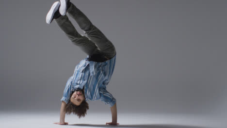 Mid-Shot-of-Dancer-Doing-Hand-Stands-with-Copy-Space