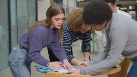 Tracking-Shot-of-Students-Working-Together-On-a-Group-Project