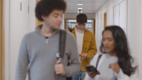 Long-Shot-of-Students-Walking-Down-Hallway