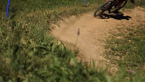 Pan-of-Cyclists-Cycling-Round-Dirt-Track