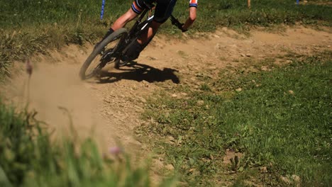 Pan-of-Cyclist-Cycling-Round-Dirt-Track