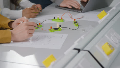 Close-Up-Shot-of-Engineering-Student-Building-Electrical-Circuit-07