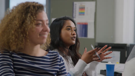 Medium-Shot-of-Students-Asking-Questions-During-a-Lesson-03