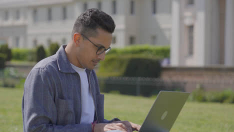 Tracking-in-Shot-of-Male-Student-Using-Laptop-in-College-Park