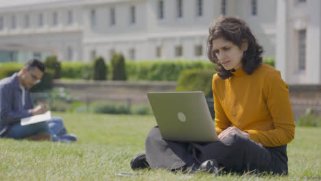 Mid-Shot-of-a-Female-Student-Working-on-Laptop-in-College-Park