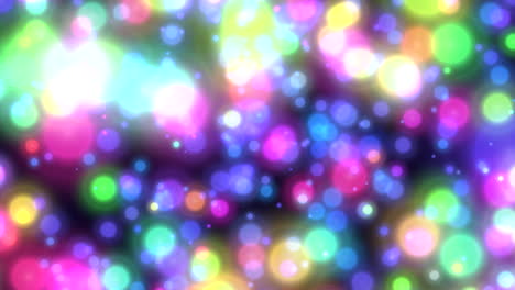 Fly-rainbow-glitters-and-round-bokeh-on-dark-space
