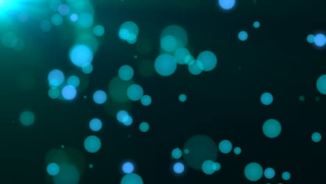 Falling-blue-round-bokeh-and-glitters-on-fashion-background