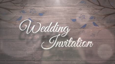 Wedding-Invitation-on-wood-with-birds-on-trees-and-round-glitters