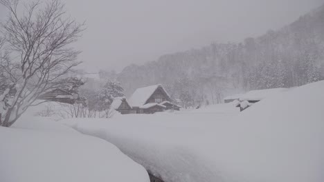 The-traditionally-thatched-houses-in-Shirakawa-go-where-is-the-mountain-village-among-the-snow-near-Gifu,-Ishikawa,-and-Toyama-prefecture-in-the-winter,-Japan