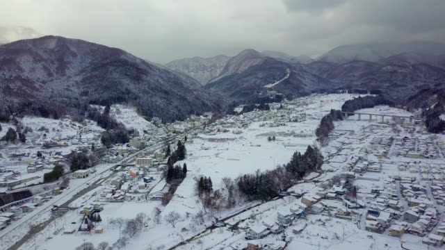 Aerial-view-of-snow-in-winter-at-Yamanouchi-in-Nagano,-Japan