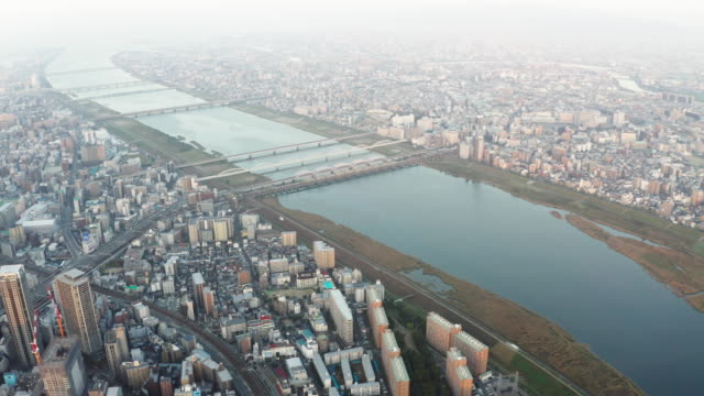 Aerial-view-over-Osaka-city-with-many-skyscrapers-in-the-morning.-Osaka-is-the-capital-city-of-Osaka-Prefecture,-the-second-largest-metropolitan-area-in-Japan.