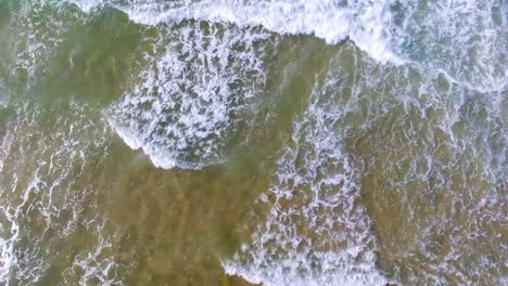 Aerial-Drone-shot:-Sea-waves-splash-tracking-shot