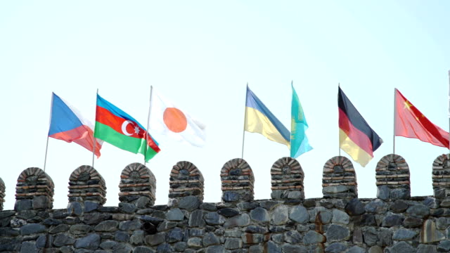 Czech-Azerbaijani-Japanese-Ukrainian-Kazakh-German-Chinese-Flags-on-fortress-wall