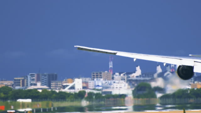 Airplane-touchdown-on-airport-runway-from-behind-in-extremely-closeup