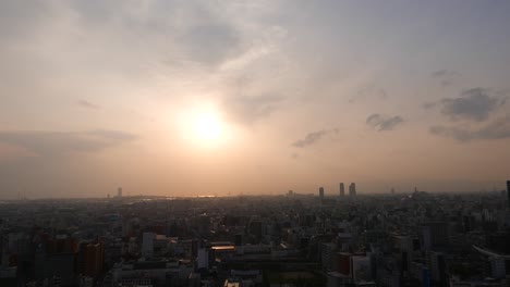Beautiful-sunset-downtown-panorama,-setting-sun-over-Osaka-city,-Japan
