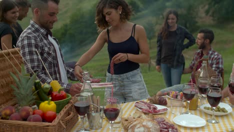 Group-of-friends-doing-a-bbq-in-the-countryside-together.-shot-in-slow-motion