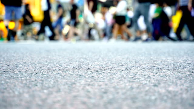 Legs-of-people-walking-on-the-crosswalk-in-Shibuya,-Tokyo-in-Japan.-4K