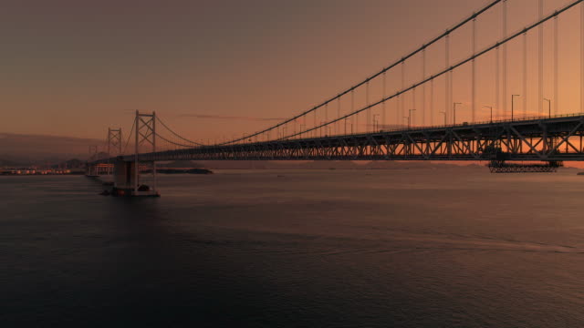Aerial---Full-view-of-the-Minami-Bisan-seto-&-Kita-Bisan-seto-bridges-Go-up-evening-dusk