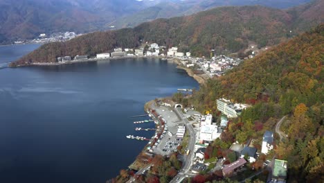 Aerial-view-over-lake-Kawaguchi,-located-in-the-border-Fujikawaguchiko-and-Minobu,-southern-Yamanashi-Prefecture-near-Mount-Fuji,-Japan.-Lake-Kawaguchi-is-a-very-popular-tourist-spot-near-Fuji-Japan.