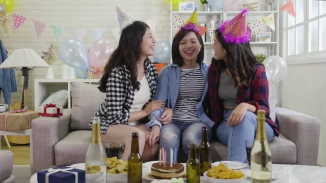 happy-party-young-girls-sitting-laughing-together