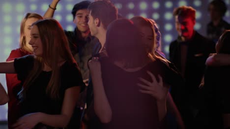 young-girls-at-club-hugging-and-celebrating