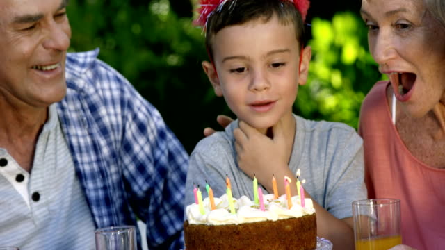 A-little-boy-blowing-out-the-candles