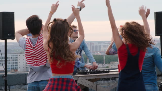 Diverse-People-Clubbing-at-Rooftop-Dj-Performance