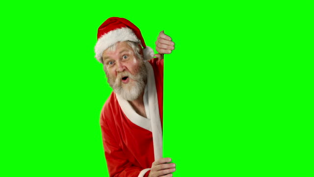 Sorprende-Papá-Noel-agitando-la-mano-en-la-pantalla-verde