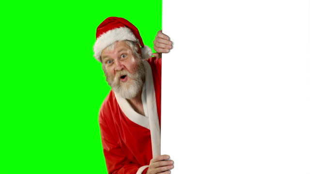 Überrascht-Santa-Claus-winken-Hand-auf-green-screen