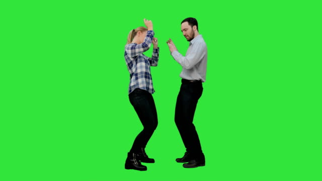Young-couple-dancing-together-on-a-Green-Screen,-Chroma-Key