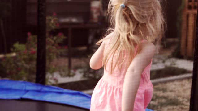 Happy-Child-Jumping-on-Trampoline.-Funny-Action-in-4k,-UHD
