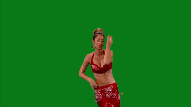 Bellydance.-Beautiful-belly-dancer-dancing-.-Green-screen.-Red-dress
