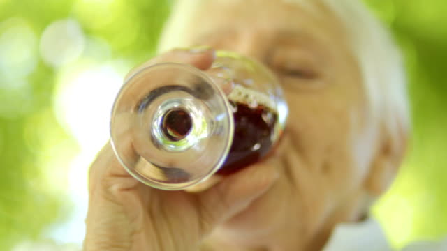 Mature-woman-drinking-red-wine