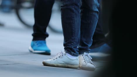 Low-angle-Legs-of-Crowd-People-Walking-on-the-Street.-Close-up-of-Crowd-feet-in-4K-60fps