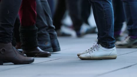 Low-angle-Legs-of-Crowd-People-Walking-on-the-Street.-Close-up-of-Crowd-feet-in-4K-60fps