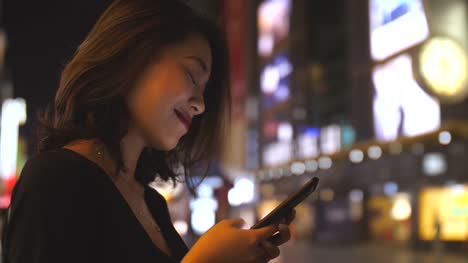 Close-up-of-woman-using-phone-in-street