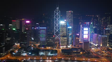 night-time-illuminated-hong-kong-city-downtown-bay-traffic-street-aerial-panorama-4k