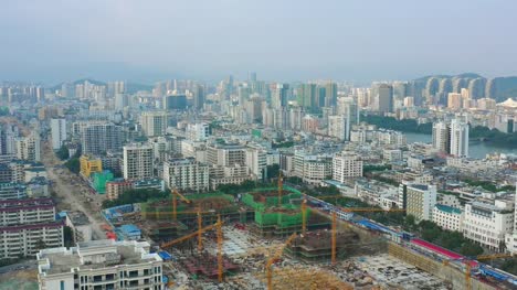 evening-time-hainan-island-sanya-city-construction-yard-aerial-panorama-4k-china