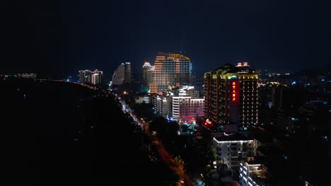 night-time-illumination-hainan-island-sanya-bay-aerial-panorama-4k-china