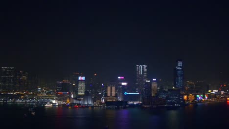 night-time-illuminated-hong-kong-city-bay-rooftop-downtown-panorama-4k-china