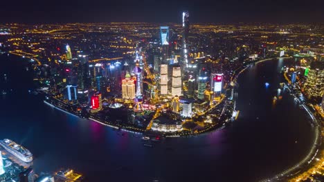 china-night-illuminated-famous-shanghai-pudong-downtown-cityscape-extra-high-aerial-panorama-4k-time-lapse