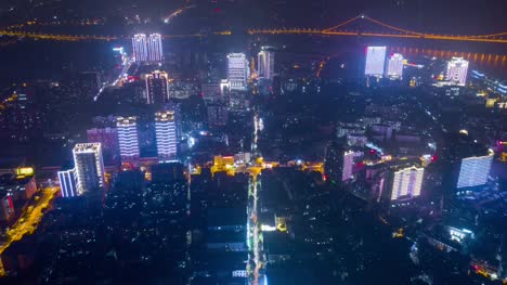 china-night-time-illuminated-wuhan-cityscape-traffic-street-downtown-aerial-panorama-4k-time-lapse