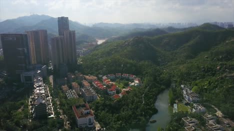 día-tiempo-zhuhai-city-famoso-hotel-montaña-panorama-aéreo-4k-en-china
