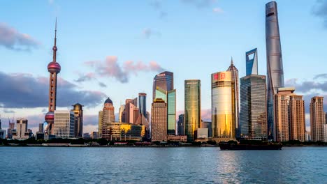 Shanghai,-China---November-1,-2016:-A-sunset-to-dusk-time-lapse-of-panoramic-view-of-busy-Huangpu-River-and-modern-skyscrapers-at-east-side-of-the-river-in-Lujiazui-Pudong-New-Area,-looking-from-the-Bund-at-west-side-of-the-river-in-central-Shanghai.