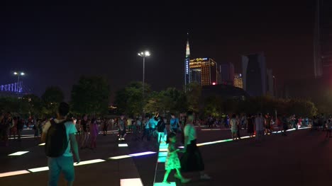 night-illuminated-guangzhou-city-crowded-square-walking-panorama-4k-china