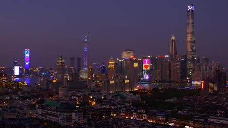 sunset-night-illuminated-shanghai-city-downtown-rooftop-panorama-4k-china