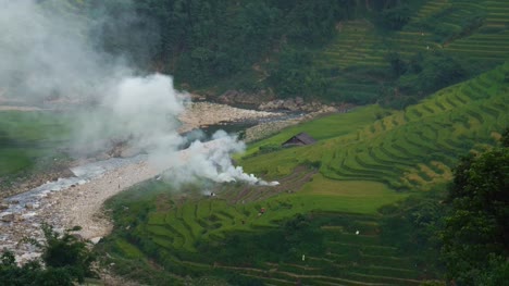 vietnamese-farmer-burning-stubble-in-rice-paddy-field-terraces-in-Sa-Pa,-Vietnam,-Asia