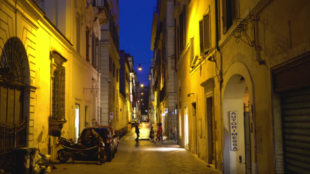 Rome,-Italy.-People-walk-on-the-night-street