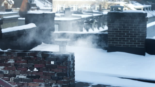 chimney-blowing-smoke-in-the-winter