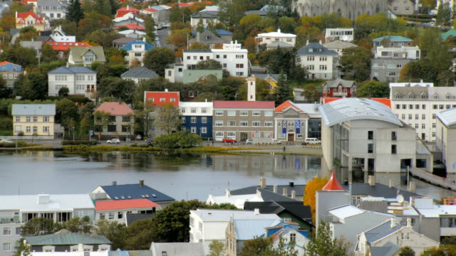top-view-of-Reykjavik-city-with-lake-Tjornin-in-autumn-time,-calm-cityscape,-colored-living-houses